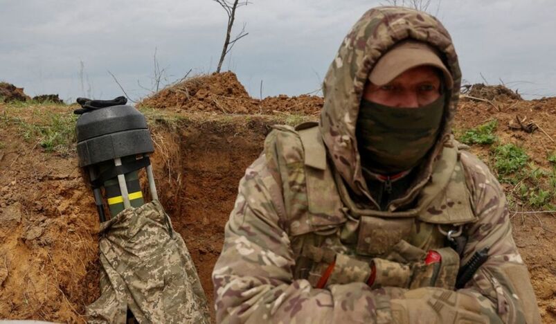 Ukrainian serviceman stand next to a Javelin anti-tank missile